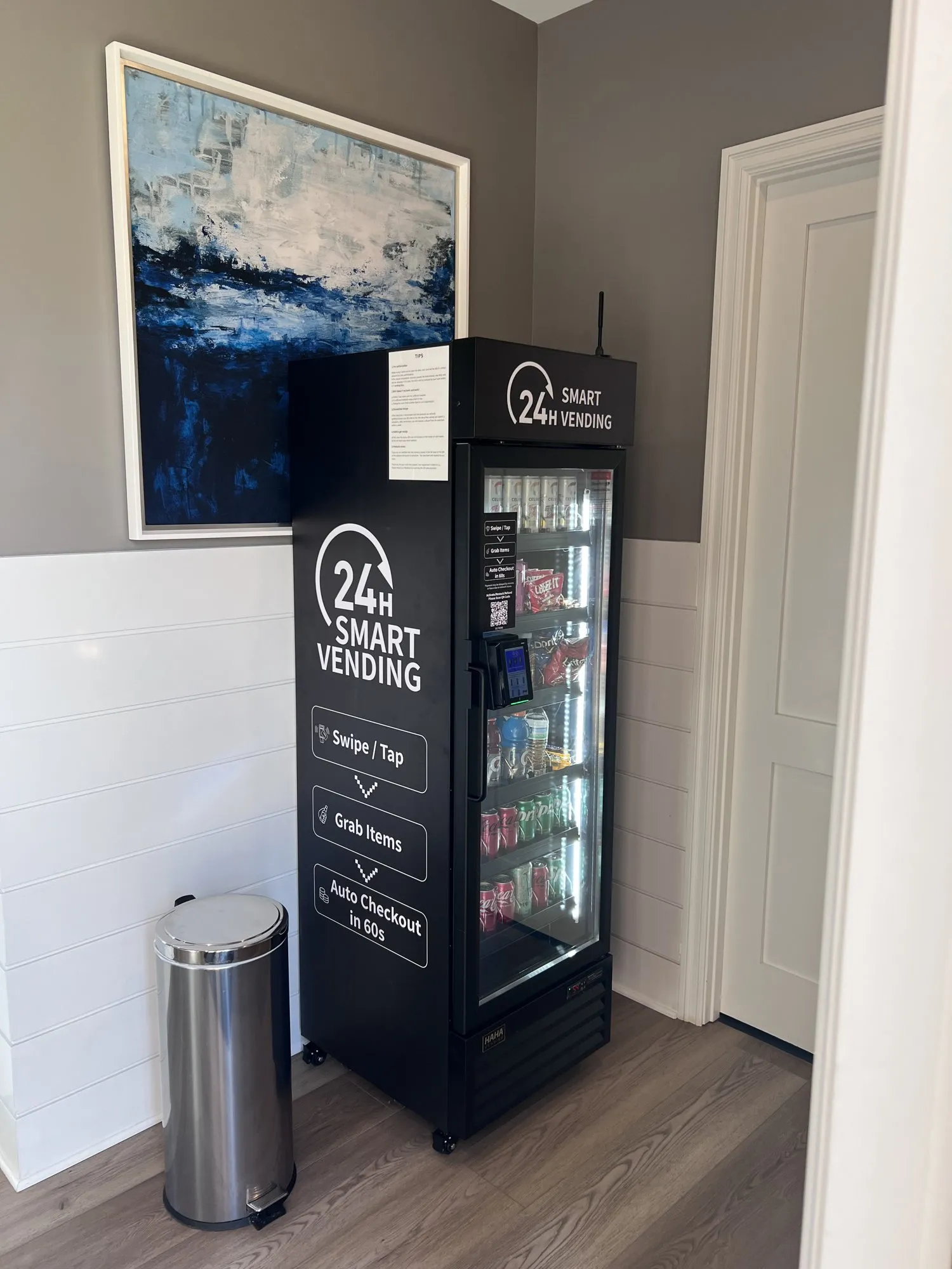 A Crossbell smart cooler stocked with drinks and snacks at a local apartment community